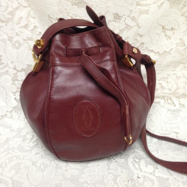 Authentic, Cartier Burgundy Leather Drawstring Shoulder Bag 9in H x 6in D