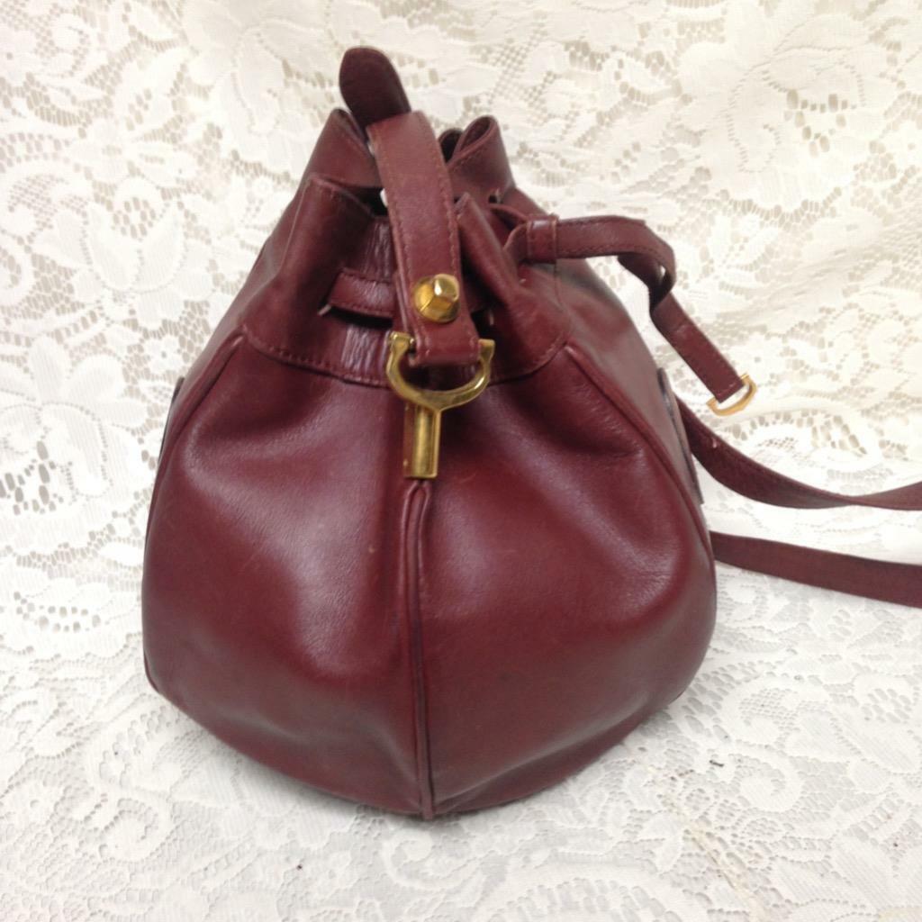 Authentic, Cartier Burgundy Leather Drawstring Shoulder Bag 9in H x 6in D