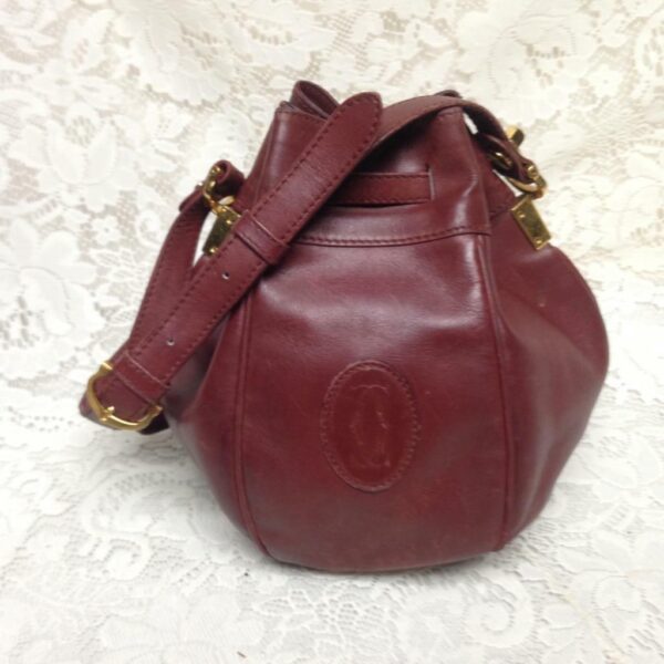 Authentic, Cartier Burgundy Leather Drawstring Shoulder Bag 9in H x 6in D