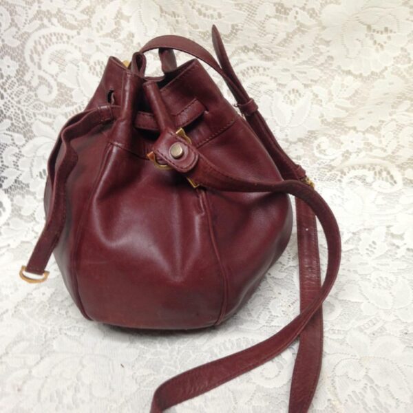 Authentic, Cartier Burgundy Leather Drawstring Shoulder Bag 9in H x 6in D