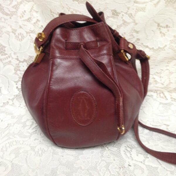 Authentic, Cartier Burgundy Leather Drawstring Shoulder Bag 9in H x 6in D