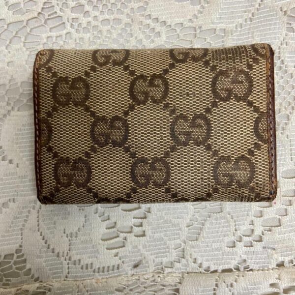 Authentic, Gucci Brown Mono 4-Hooks Key Case 3.5in x 2.5 in (T0322)