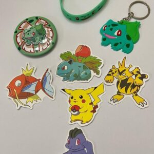 Lot of 8 Pokemon Collectibles. (D)