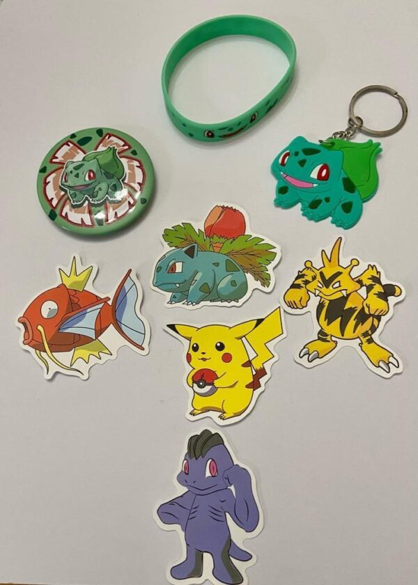 Lot of 8 Pokemon Collectibles. (D)