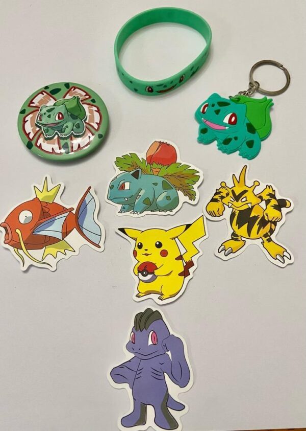 Lot of 8 Pokemon Collectibles. (D)