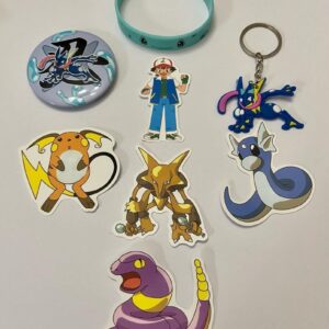 Lot of 8 Pokemon Collectibles. (E)