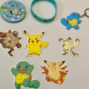 Lot of 8 Pokemon Collectibles. (F)