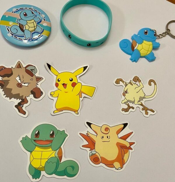 Lot of 8 Pokemon Collectibles. (F)