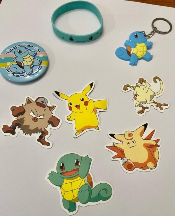 Lot of 8 Pokemon Collectibles. (F)