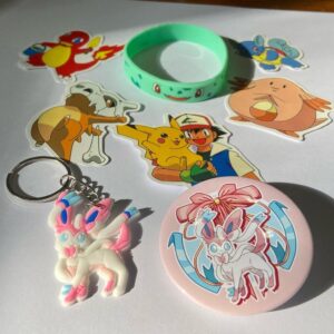 Lot of 8 Pokemon Collectibles. (H)