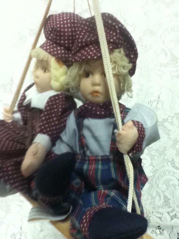 Beautiful, 9-inch, Dutch Boy And Girl Dolls on a Swing