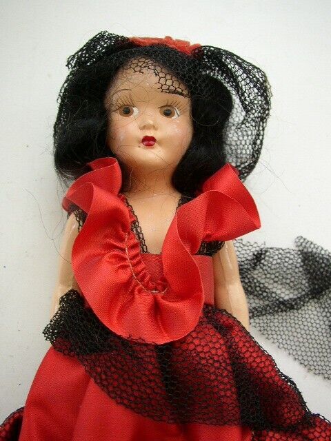 Vintage, 7.5″ Composition Face -Plastic Doll in Red Gown