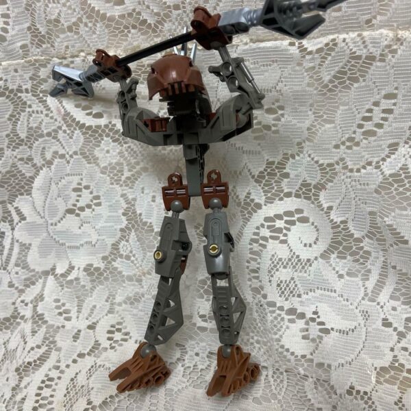 Vintage, Rare, Lego, Bionicle Brown Action Figure with Silver Spear 8in x 9in