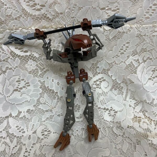 Vintage, Rare, Lego, Bionicle Brown Action Figure with Silver Spear 8in x 9in