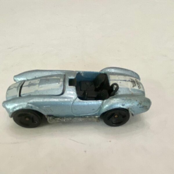 Vintage Hotwheels-Mattel Inc. 1983 blue and white striped sports car