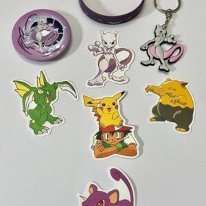 Lot of 8 Pokemon Collectibles. (B)