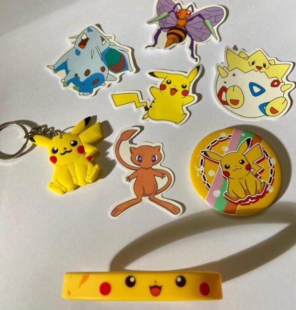 Lot of 8 Pokemon Collectibles. (A)