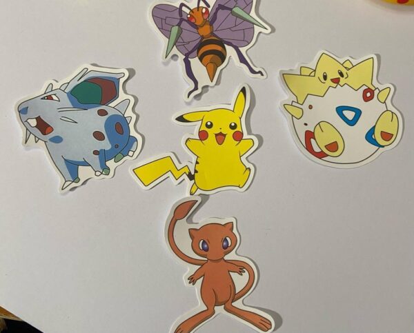 Lot of 8 Pokemon Collectibles. (A)