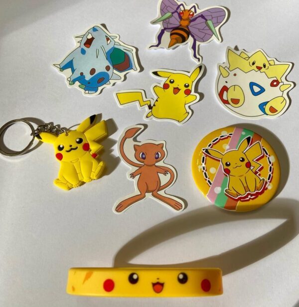 Lot of 8 Pokemon Collectibles. (A)