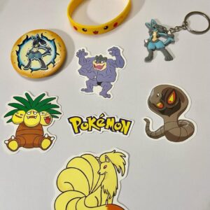 Lot of 8 Pokemon Collectibles. (C)