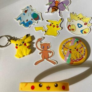 Lot of 8 Pokemon Collectibles. (A)